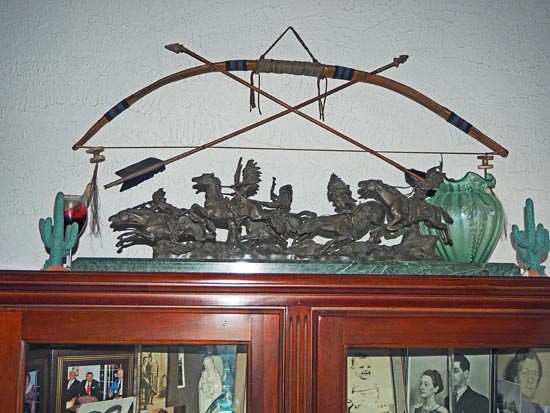 Western-themed bronze sculpture, bow and arrows