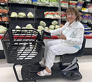 Rosanne in motorized shopping cart